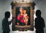 Two visitors to the Christie's Fine Art Storage admire an Italian Renaissance painting worth US$9million called 'The Madonna and Child' on Jun 28 2013